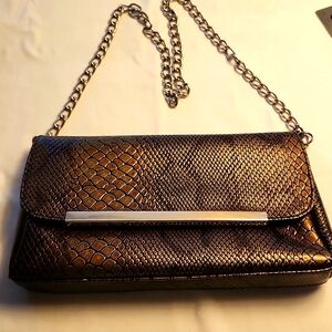Bijoux Terner bronze snakeskin finish purse with chain strap. Pre-owned vintage